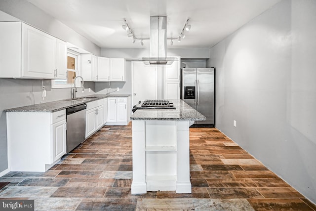 kitchen featuring island exhaust hood, stainless steel appliances, white cabinets, and a kitchen island