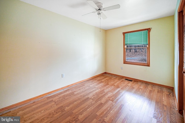 unfurnished room with ceiling fan and light hardwood / wood-style floors