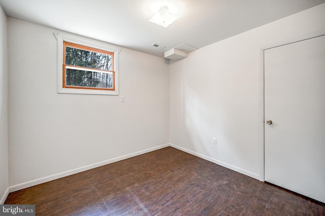 unfurnished room featuring dark hardwood / wood-style flooring