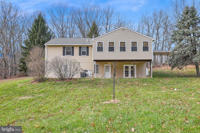 view of front of house featuring a front yard and central AC unit