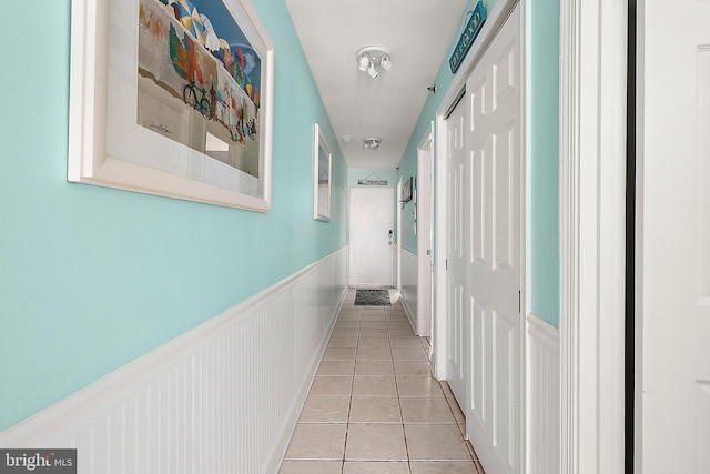 corridor featuring light tile patterned floors