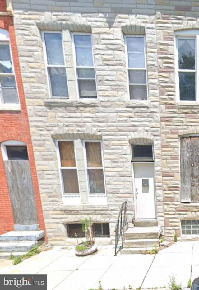 2126 W Fairmount Ave, Baltimore, MD 21223 - view of property featuring stone siding and entry steps