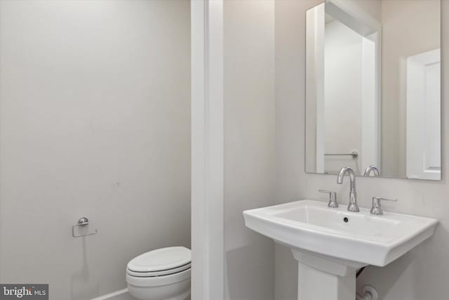 bathroom with sink and toilet