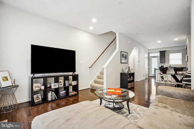 living room featuring dark wood-type flooring