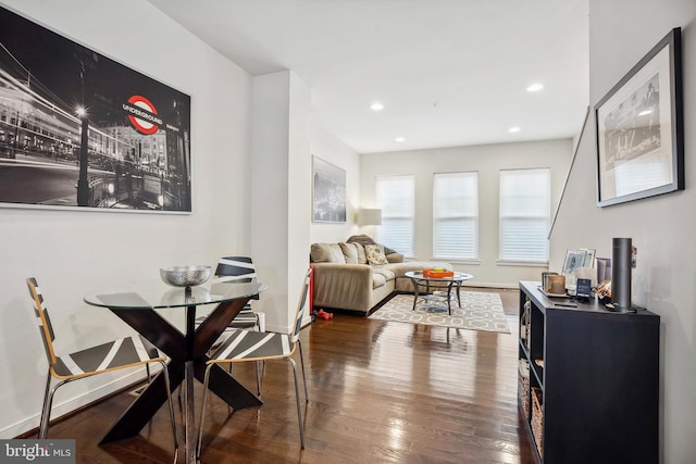 dining room with dark hardwood / wood-style floors