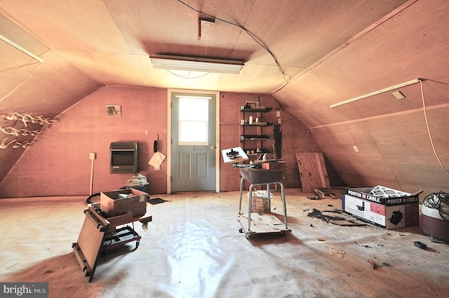 bonus room with heating unit and lofted ceiling