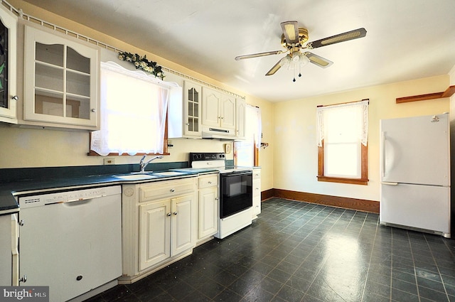 kitchen featuring white appliances, ceiling fan, and sink