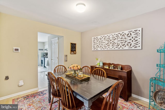 dining room with light wood-type flooring