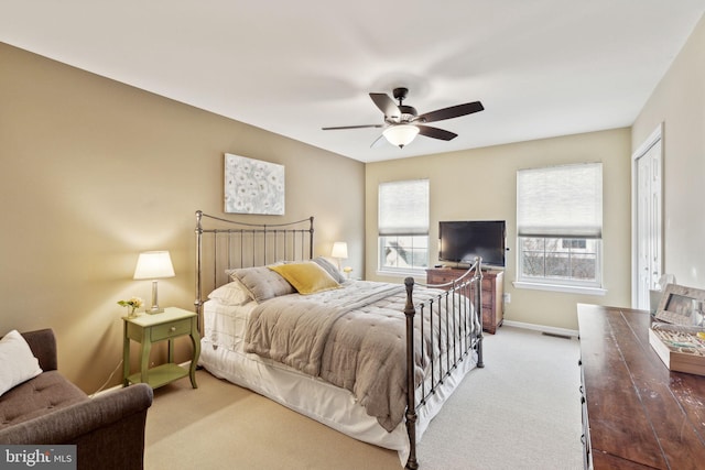 carpeted bedroom with a closet and ceiling fan