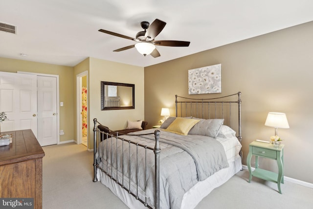 bedroom featuring ceiling fan and light colored carpet