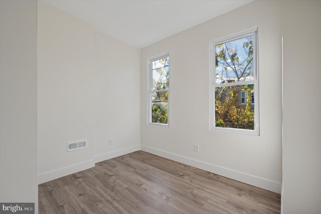 unfurnished room featuring light hardwood / wood-style flooring