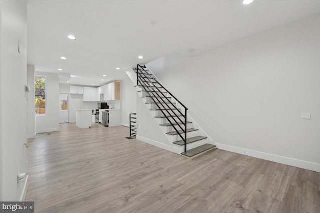 unfurnished living room featuring light hardwood / wood-style floors