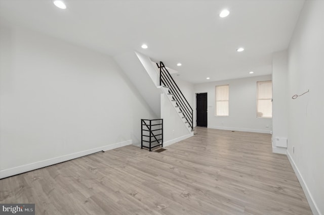 unfurnished living room featuring light wood-type flooring