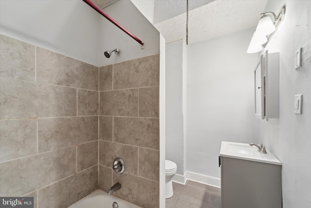 full bathroom with tile patterned flooring, vanity, toilet, and tiled shower / bath