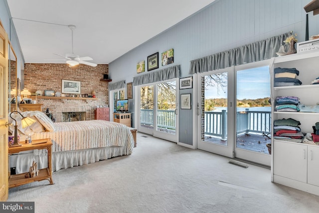 carpeted bedroom featuring access to exterior, ceiling fan, and lofted ceiling