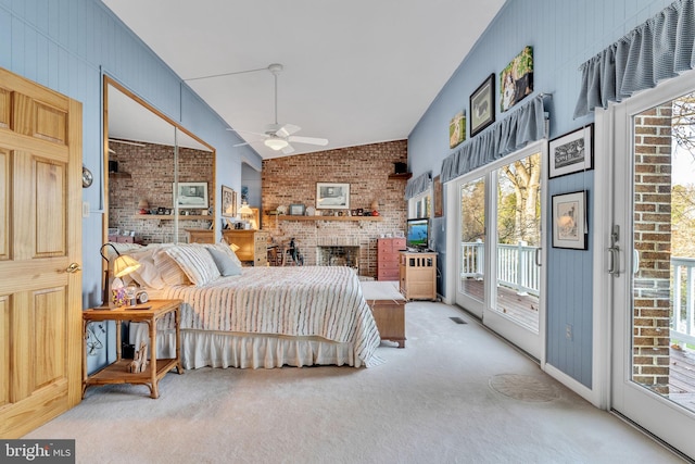 carpeted bedroom featuring access to exterior, ceiling fan, and lofted ceiling