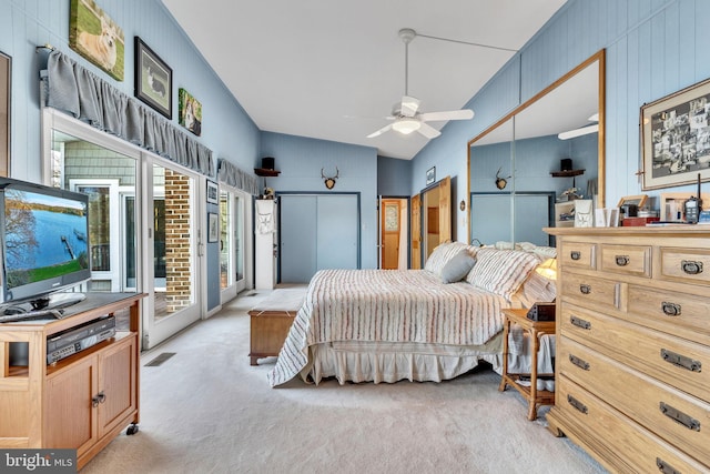 carpeted bedroom with ceiling fan, lofted ceiling, and access to outside