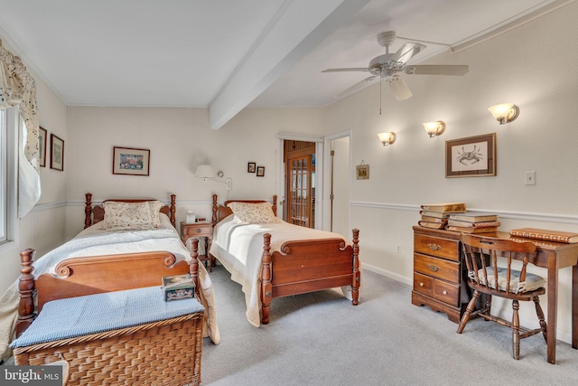 bedroom featuring carpet, beam ceiling, ceiling fan, and ornamental molding