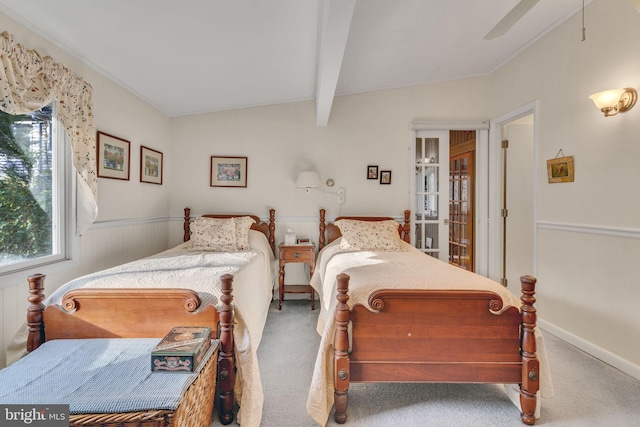 bedroom with vaulted ceiling with beams, ceiling fan, and carpet floors