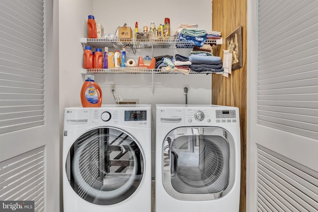 washroom with independent washer and dryer