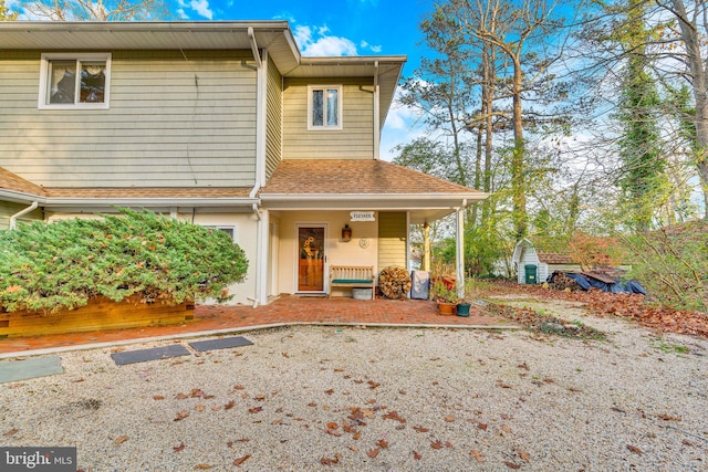 rear view of house with a porch