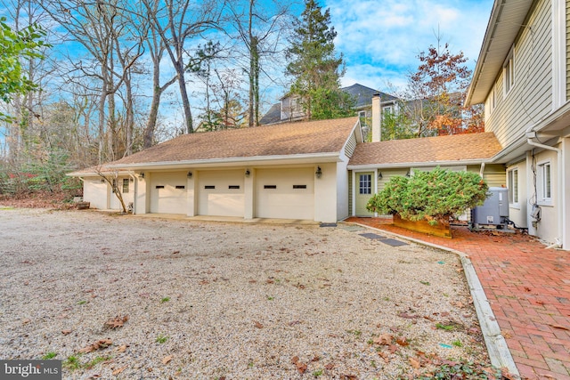 view of property exterior with a garage