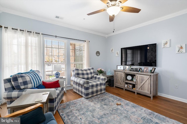 living room featuring crown molding, ceiling fan, and wood-type flooring