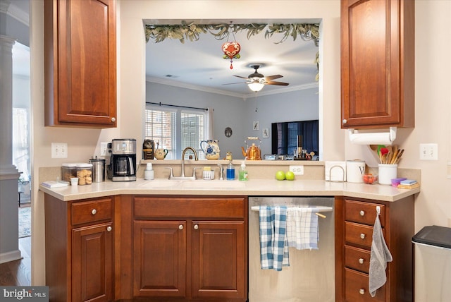 kitchen featuring sink, ceiling fan, decorative columns, ornamental molding, and stainless steel dishwasher