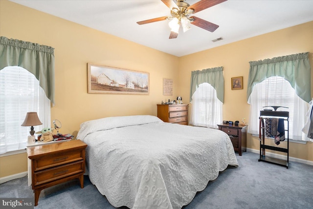 bedroom with ceiling fan and carpet