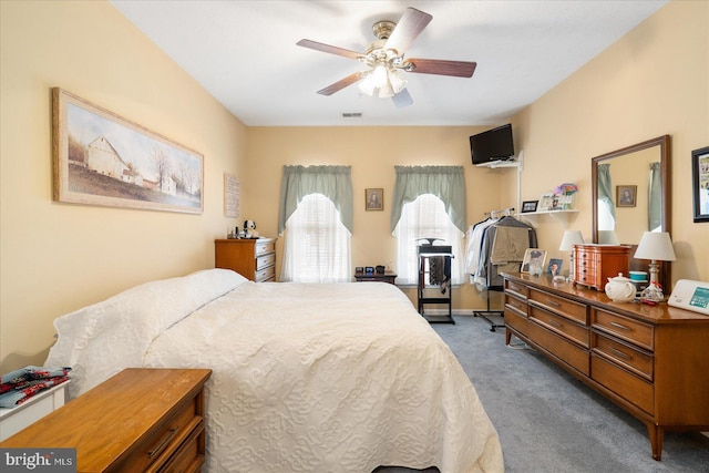 carpeted bedroom with ceiling fan