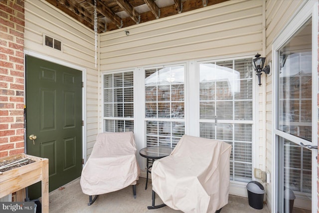 exterior space featuring beamed ceiling