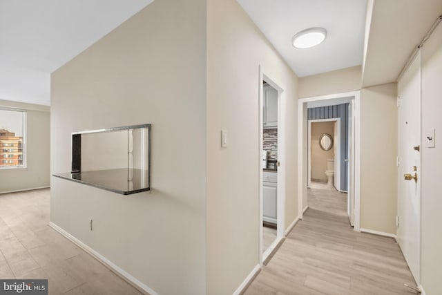 hallway featuring light wood-type flooring