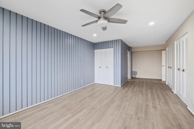 unfurnished bedroom featuring ceiling fan and light wood-type flooring