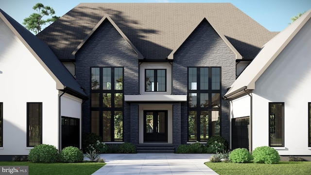 view of front of house featuring stone siding and stucco siding