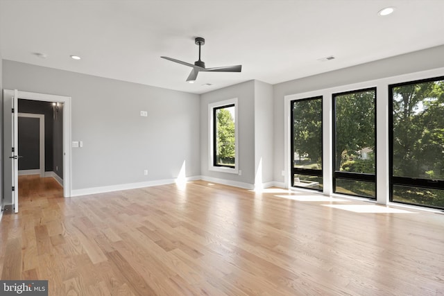 interior space with recessed lighting, baseboards, light wood-style floors, and a ceiling fan