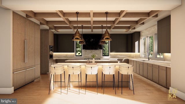 kitchen with light hardwood / wood-style flooring, beamed ceiling, and coffered ceiling