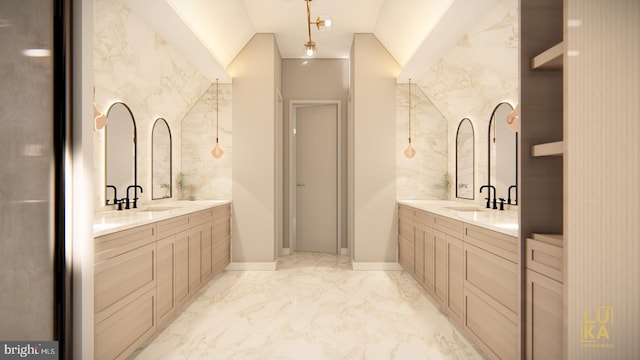 full bath featuring vaulted ceiling, two vanities, marble finish floor, and a sink