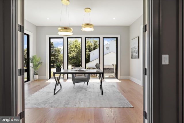 office area featuring recessed lighting, light wood-type flooring, and baseboards