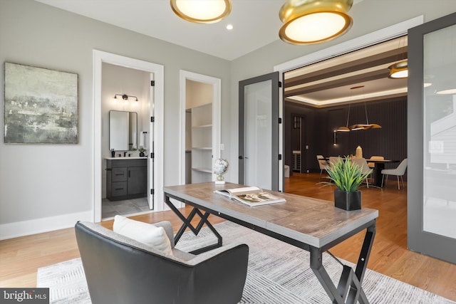 office with recessed lighting, light wood-style flooring, and baseboards