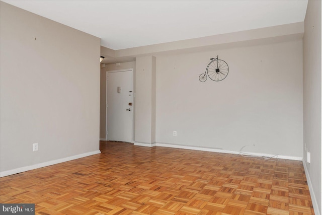 empty room with light parquet floors