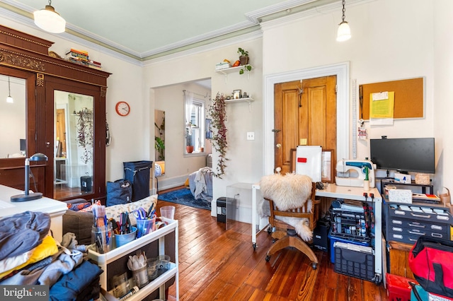 bedroom with hardwood / wood-style floors and crown molding