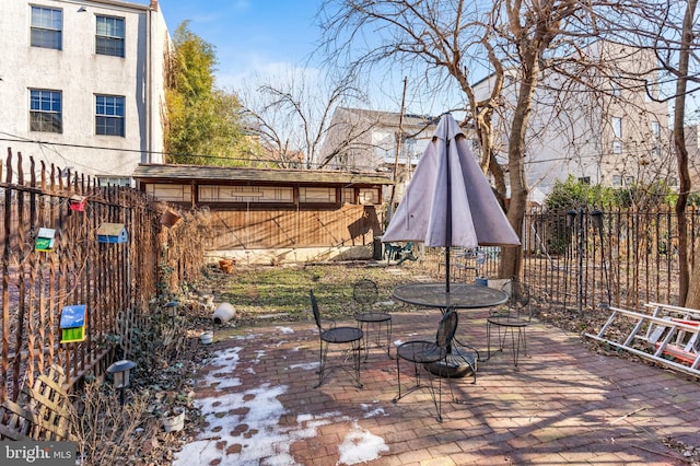 view of patio featuring fence