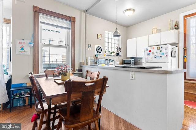 dining room featuring light wood-style floors