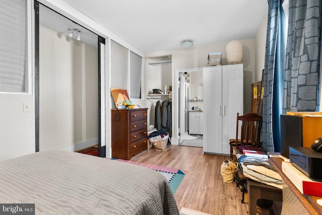 bedroom featuring wood finished floors