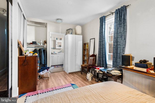 bedroom featuring wood finished floors