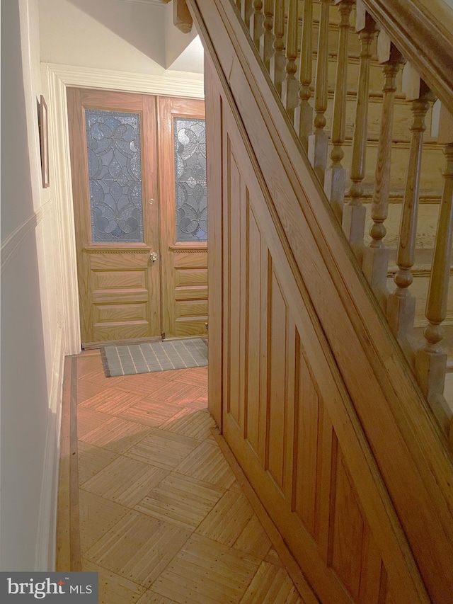 hallway featuring stairs