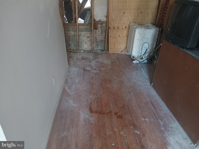 interior space featuring wood-type flooring and radiator heating unit