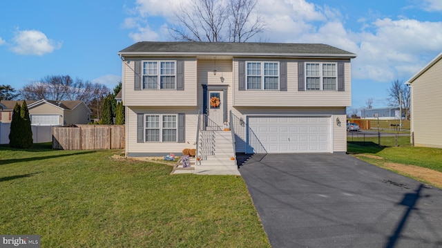 split foyer home with a garage and a front lawn