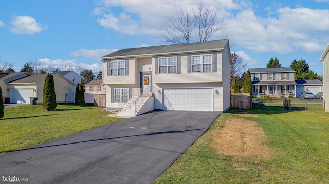 split foyer home with a garage and a front lawn