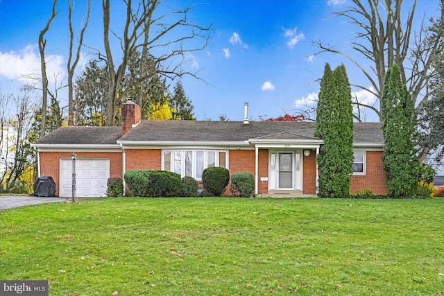 single story home with a garage and a front lawn